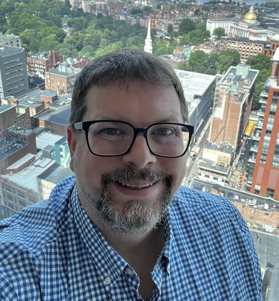 Randall Helms, founder of FFP One, photographed high above Boston with the Common, Park Street Church and the gold dome of the Massachusetts State House in the background.